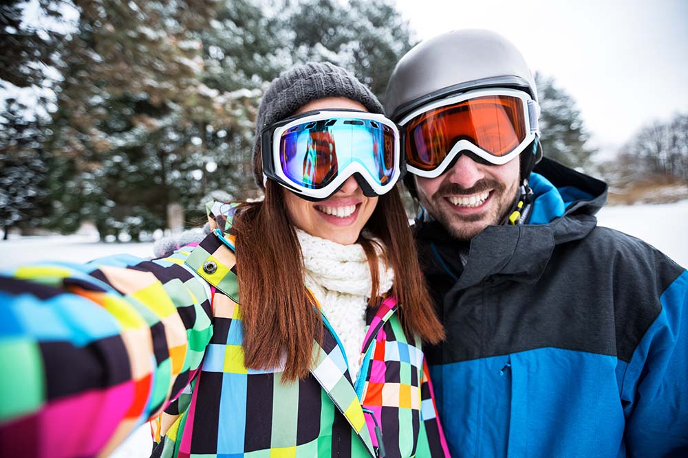 Skiing Couple Taking Selfie