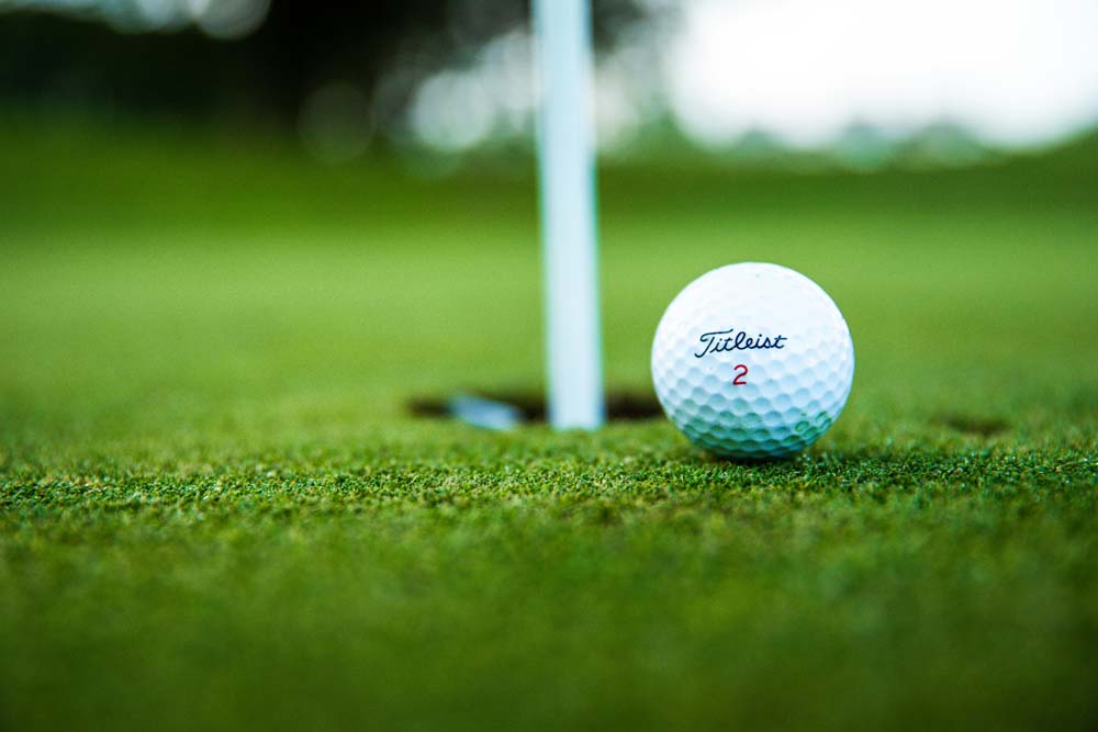 Photo by Thomas Ward: https://www.pexels.com/photo/close-up-photo-of-golf-ball-2828723/
